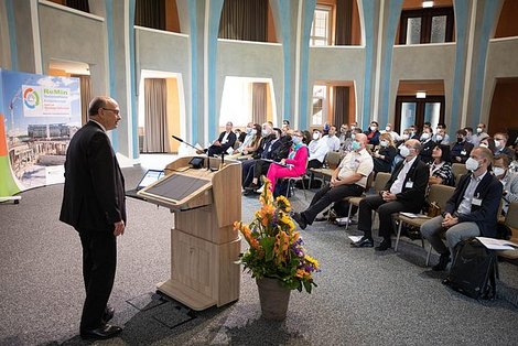 Person standing in front of an audience